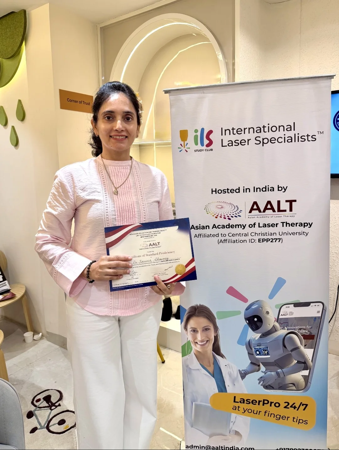 Dr. Karuna Singh Sawhny with a Certificate of Standard Proficiency from a laser dentistry workshop, International Laser Specialists and AALT