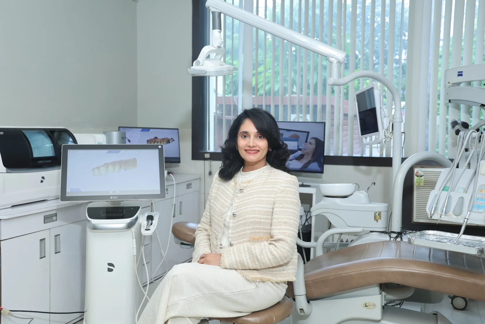 Dr. Karuna Singh Sawhny seated in the digital treatment room at Dr Sawhney’s My Dentist, Kakadeo, Kanpur