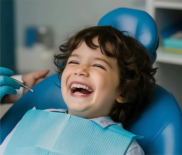 Child smiling during a comfortable dental checkup — kids and family dentistry at Dr Sawhney's My Dentist, Kakadeo, Kanpur