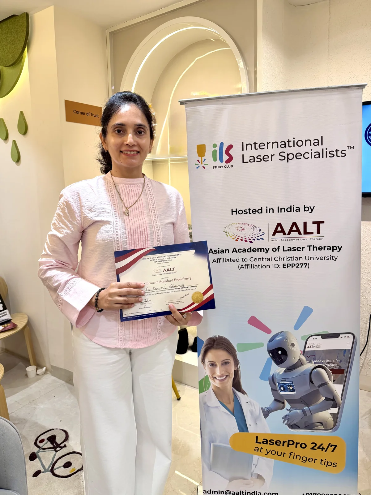 Dr. Karuna Singh Sawhny holding a Certificate of Standard Proficiency in Laser Dentistry and Safety, issued by NovoLase Education and Training in collaboration with AALT